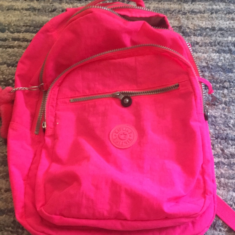 Bright pink Kipling backpack